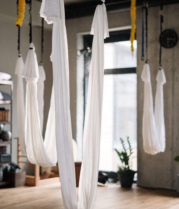 Person practicing gentle yoga movements for mobility indoors